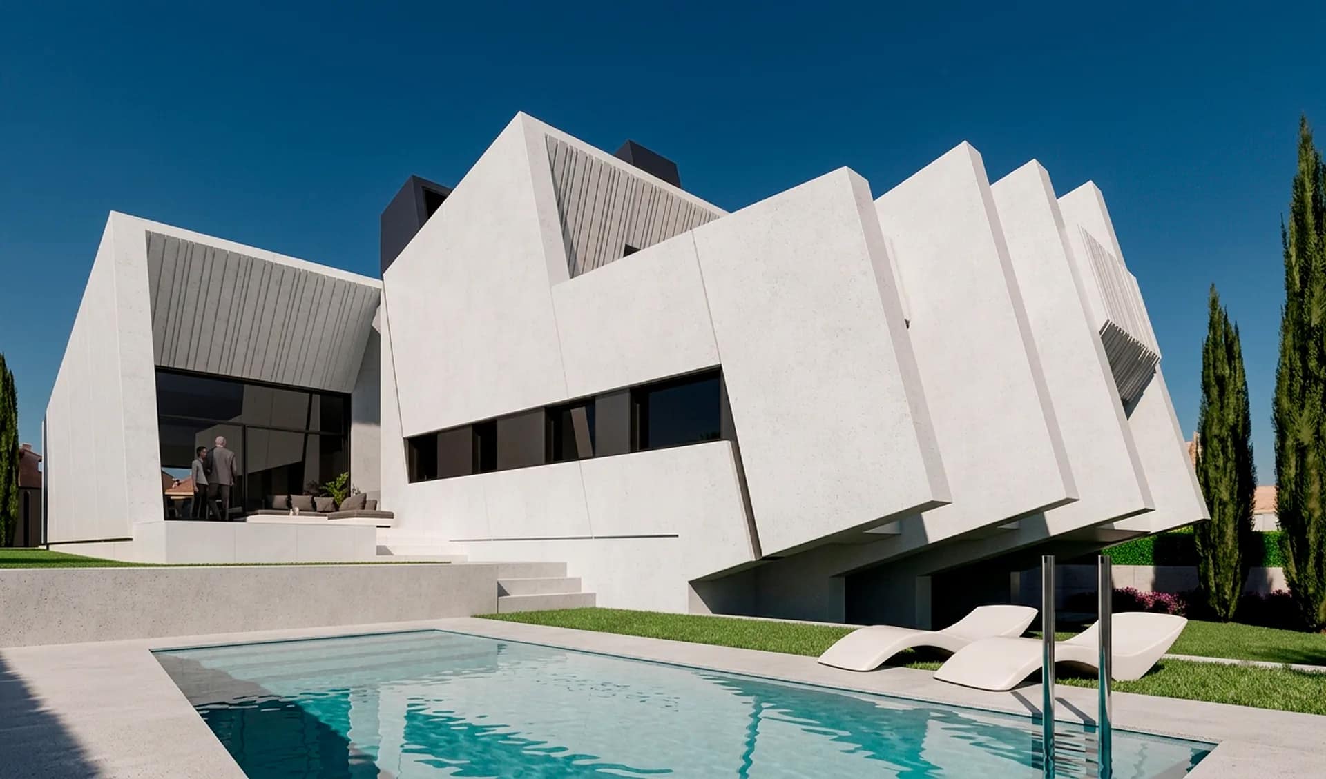 Piscina y fachada de volúmenes blancos de la Casa Ponce